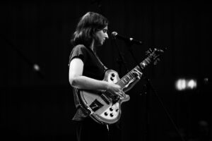 Abi Budgen playing an electric guitar