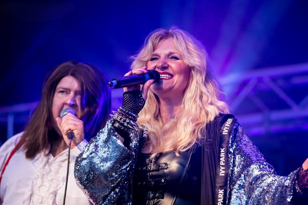 Andy Plimmer as Meat and Sally Rivers singing into microphones - Copyright Appleton Event Photography