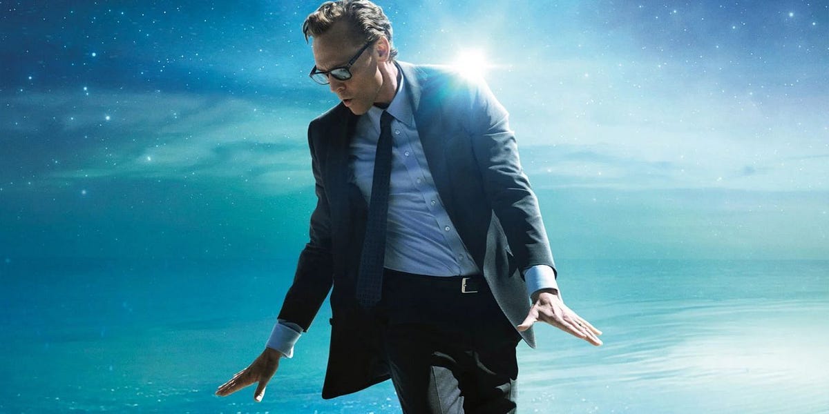 Tom Hiddleston as Chuck, wearing a suit, shirt and tie, and also wearing sunglasses