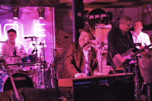 Vehicle five-piece band playing their musical instruments