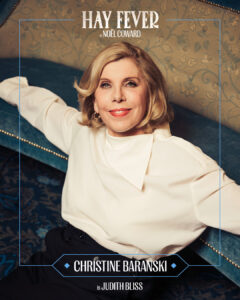 Promotional poster featuring a smiling blonde woman in a white blouse on a blue velvet sofa with a decorative frame and 'Hay Fever' text at the top.
