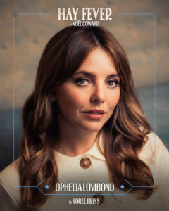 Poster featuring Ophelia Lovibond for Hay Fever; portrait of a woman with wavy brown hair, white top, soft lighting, blue border framing the shot.